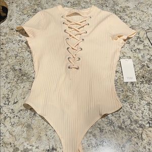 Shirt sleeve body suit